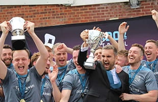 London football team celebrating a midweek 11-a-side league and cup double win